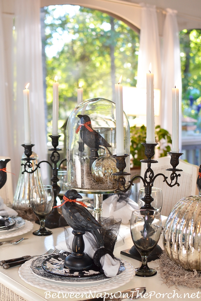 Halloween table setting with mercury glass pumpkins and black ravens