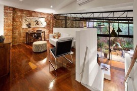 Home office on the newly added top level overlooking the living area below