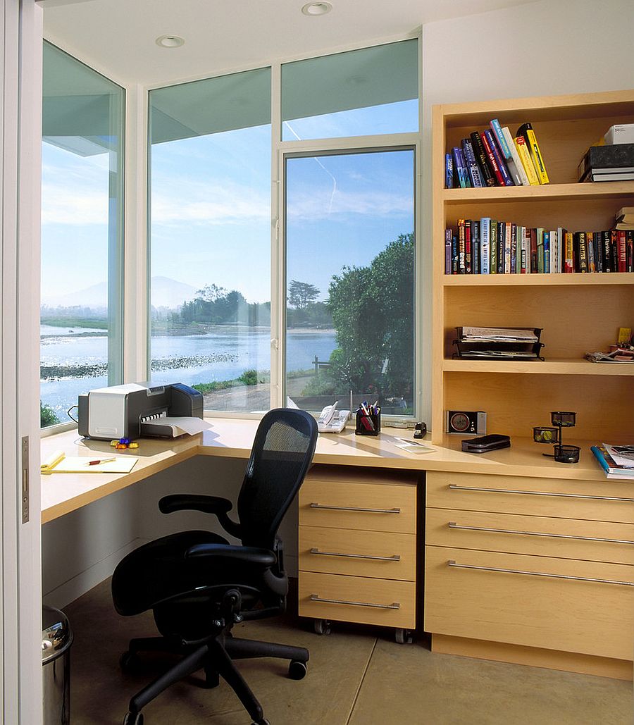 Home office with smart wooden shelves and a refreshing view