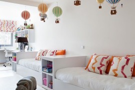 Hot air balloons are by Authentic Models bring color to the contemporary kids bedroom