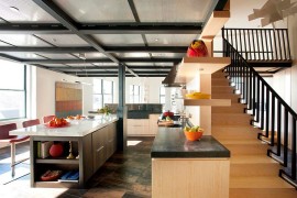 Kitchen ceiling crafted using perforated aluminum panels and steel structural beams [Design: Eck MacNeely Architects]