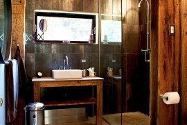 Lovely rustic bathroom design with reclaimed wooden vanity