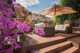 Lovely wooden deck of apartment in rome with shaded lounge