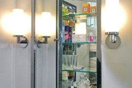 Mirrored medicine cabinet with glass shelving