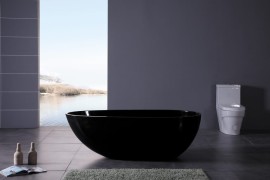 Modern black bathtub in a grey powder room