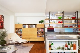 Open kitchen island shelves offer a smart display for wine collection