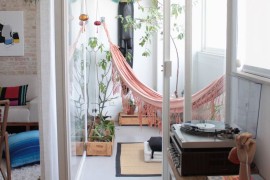 Pink hammock in a sunroom