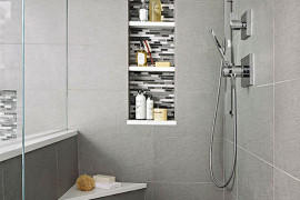 Small corner bench in a modern gray walk-in shower
