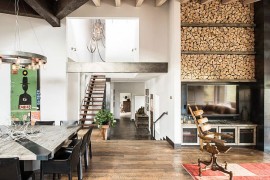 Stacked wood next to the fireplace becomes a stylish addition to the living space