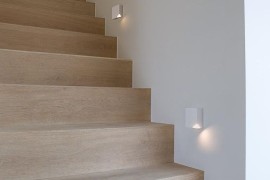 Staircase light fixtures with corners removed to light up the steps