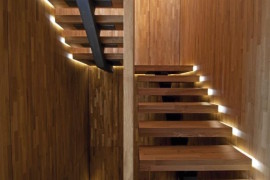 Staircase with lighting along the sides for a floating look