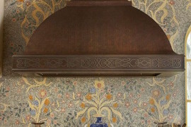 Very detailed mosaic backsplash featuring flowers and vases