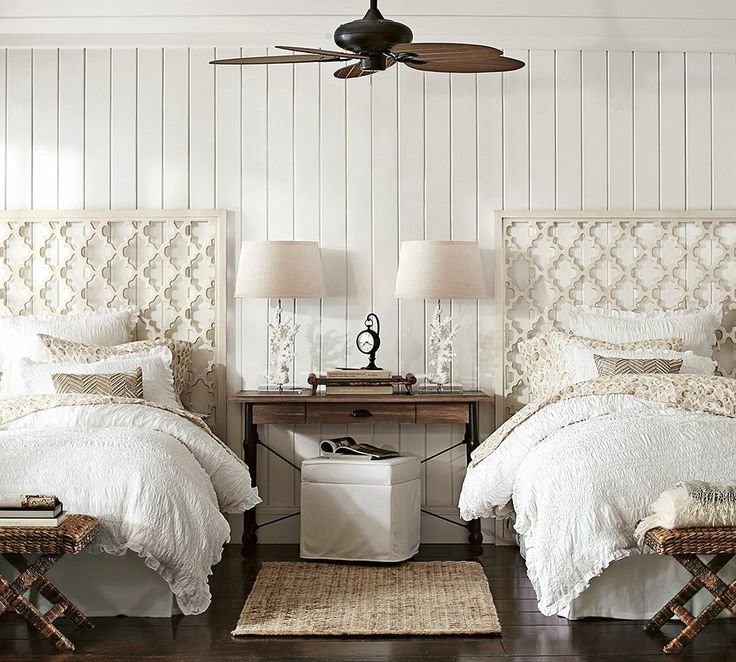 White coastal themed guest room with twin beds