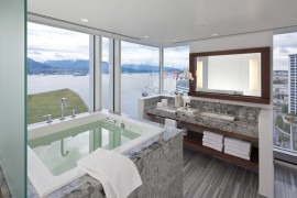 Window-filled bathroom with a sea view