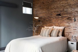 Wooden accent wall for the gray rustic bedroom