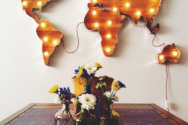 World map marquee sign hung on the wall