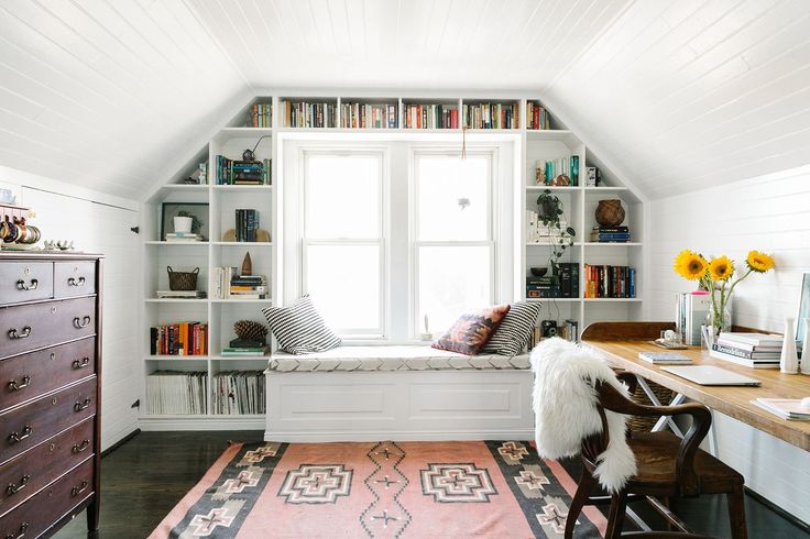 Attic office space with great shelving around window