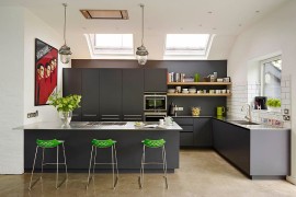 Bar stools and poster add color to the kitchen in gray