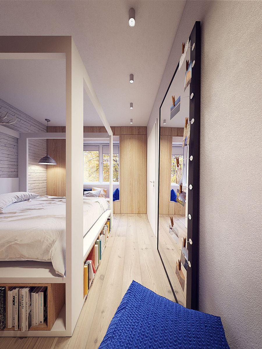 Bedroom with sleek Scandinavian style and a giant mirror