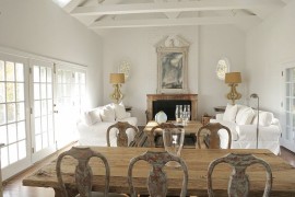 Brick wall fireplace blends in with the rest of the room in white [Design: English Country Antiques]