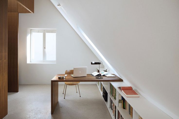 Bright attic with interesting desk for an office space