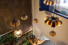 Brilliant use of pendant lighting to enliven the staircase duct