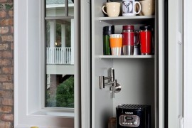 Cabinet area transformed into a tiny coffee station