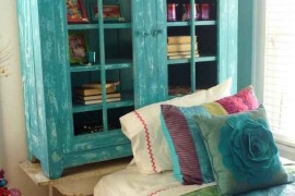 Cabinet turned bookshelf painted to match bedding