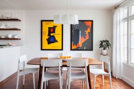 Cheerful dining room in white with Logico pendant and framed posters