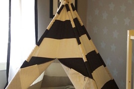 Classic teepee made with sticks and striped fabric