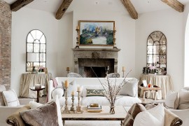Classy chaise lounge and wooden beams inside the lovely living room [Design: Thompson Custom Homes]
