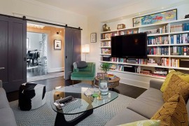 Contemporary family room with sliding barn doors in gray