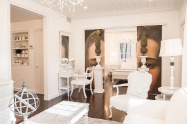 Custom painting applied on sliding barn doors gives the living room a unique dynamic