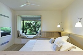 Custom window seat and furniture in wood for the bedroom