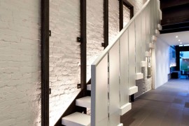 Dark steel becomes both structural and decorative element inside the elegant home