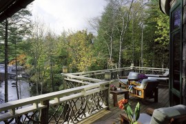 Design of the railing adds to the rustic charm of the gorgeous deck