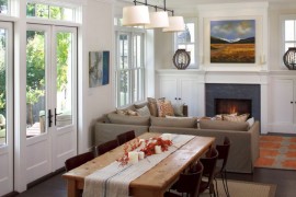 Dining room centerpiece with pillar candles and berries