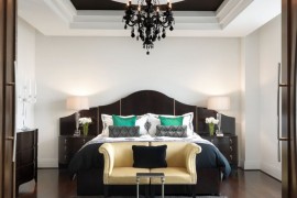 Dramatic painted recessed ceiling in an elegant bedroom