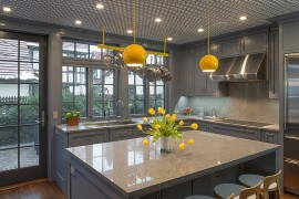 Even the tiniest hint of yellow stands out brightly in this all-gray kitchen [Design: essential design + build]