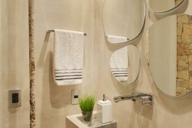 Fabulous collection of mirrors above the bathroom vanity