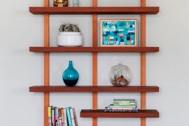Floating wooden shelf keeps things simple and minimal