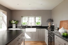 Functional farmhouse kitchen in gray and black [From: Ryan Wicks Photography]
