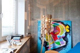 Gorgeous floor lamp and colorful art work add character to the interior