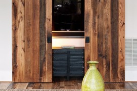 Hide the living room TV behind custom sliding barn doors