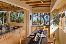 Indoor dining area of the cabin placed to make the most of scenic view outside