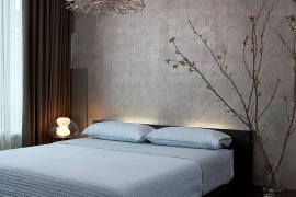 Lighting and minimalism give this contemporary bedroom a zen-inspired look