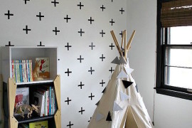 Little reading nook teepee besides a bookshelf