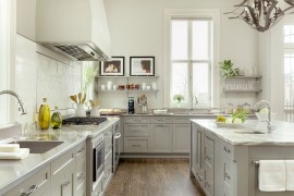 Lovely light gray for the kitchen cabinets enhances the appeal of this cheerful kitchen [Design: Mitchell Wall Architecture & Design]