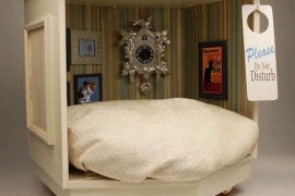 Luxurious cat bed complete with miniature wall art pieces