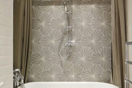 Luxury bathroom with a ceiling-mounted shower curtain rail